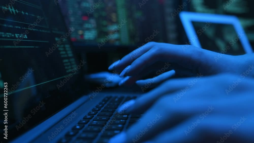 Poster close up view of female hacker hands, typing on keyboard.