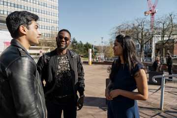 Group of student friends talking on campus