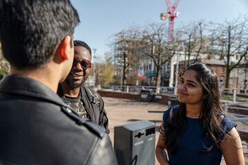 Group of student friends talking on campus
