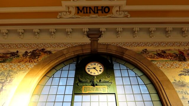 Old vintage station clock inside train station at Sao Bento, Porto, Portugal