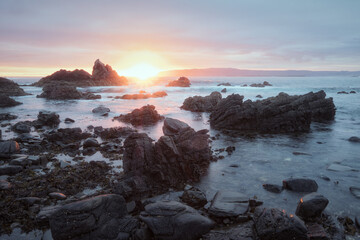 Sunrise over the seashore with cliffs. Nature morning autumn sea background. Durness, Scotland