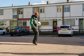 Young man playing football outdoors