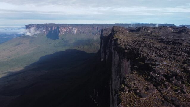 Aerial dolly in shot over Roraima Tepui ancient mountains in Venezuela. Explore South America
