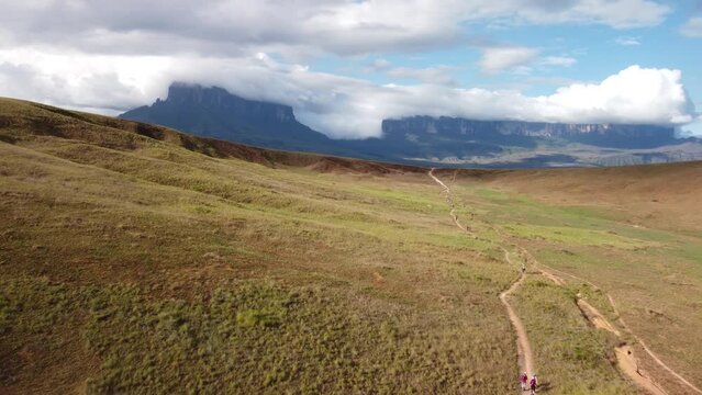 Aerial view of a group of people hiking a trail through Roraima Tepui in Canaima National Park. Exploring Venezuela