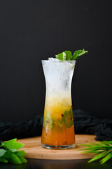 Passion Fruit Mojito in Black Background