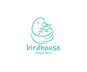 Bird holds in its beak a branch with leaves in the form of a house logo design. The bird flaps its wing, which looks like a nest graphic design