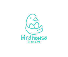 Bird sitting on the nest with eggs logo design. The bird flaps its wing, which looks like a nest graphic design