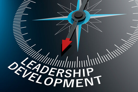 Compass needle pointing to leadership development word
