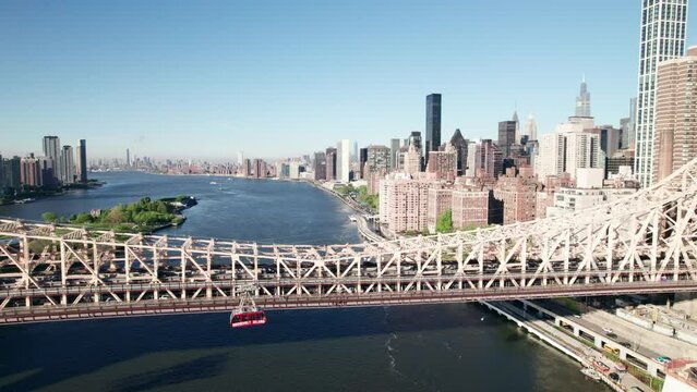 Roosevelt Island Tram and Queensboro Bridge. New York City, 4K drone shot.