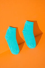 teal socks new on orange background