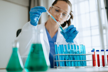 Modern medical research laboratory. female scientist working with micro pipettes analyzing...