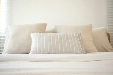 Fototapeta na wymiar bed in a modern white tone loft room
