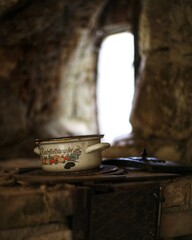Cast iron stove in a cave dwelling at Langenstein in the Harz mountains. Kartoffeldampfer (potato steamer) is written on the pot