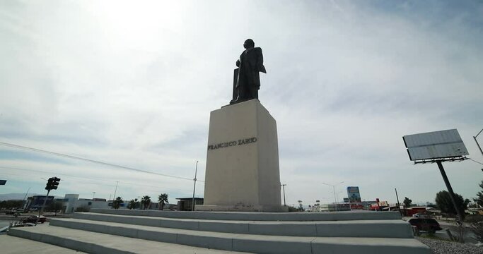 Low view of a monument statue of the mexican ex-president Francisco Zarco in a roundabount in the city of Mexicali
