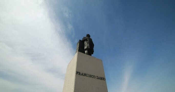 Low view of a monument statue of the mexican ex-president Francisco Zarco with sky on the background in the city of Mexicali