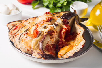 Baked cooked grilled eggplant with mozzarella cheese, tomatoes. Georgian cuisine. 