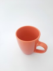 Mug on white background, orange mug, cup, orange cup