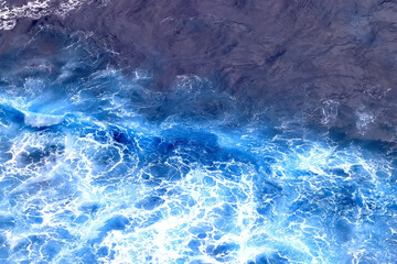 Fototapeta na wymiar wave in the ocean abstract background, blue sea texture motion