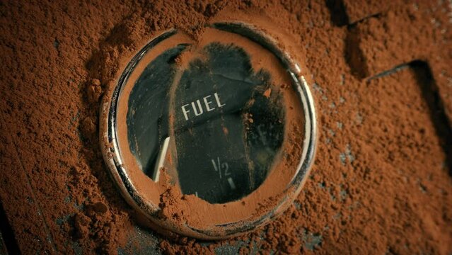 Wiping Dirt Off Fuel Gauge In Dirty Vehicle