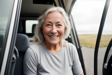 Senior woman with silver hair sitting in van. Blurred background with mockup. Generative AI.