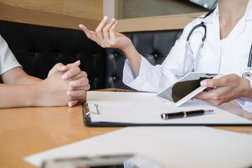 Professional medical doctor in white uniform gown coat interview consulting patient