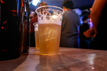 Draft beer.  Enjoying Evening Drinks at the pub party in a nightclub .