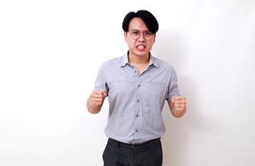 Angry asian man standing with fist hands. Isolated on white