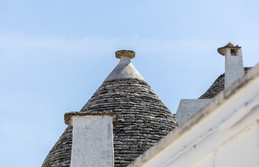 Fototapeta na wymiar Typical trulli houses with conical roof in Alberobello, Apulia, southern Italy