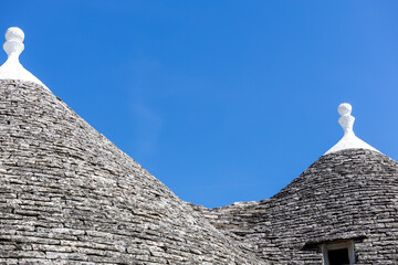 Fototapeta na wymiar Typical trulli houses with conical roof in Alberobello, Apulia, southern Italy