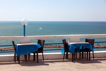 Tables of the restaurant on the seashore