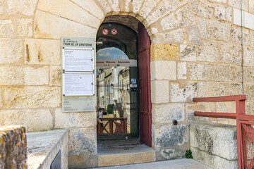 Entrance of the Lantern Tower seen from the Rue sur les Murs pedestrian walkway in La Rochelle, France