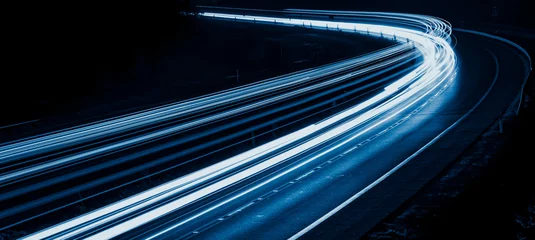 Foto op Plexiglas Snelweg bij nacht blue car lights at night. long exposure