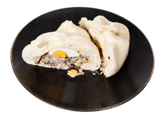 cut Banh Bao steamed bun on plate cutout on white background