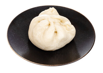cooked Banh Bao steamed bun on plate cutout on white background
