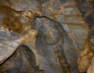 Natural stone wall in cave