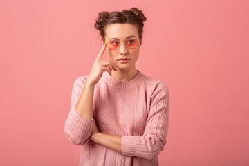 young pretty cute woman in stylish outfit in pink sweater and sunglasses