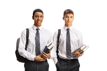 Male students in school uniforms holding books