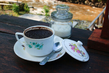 traditional coffee, at a riverside cafe.