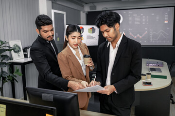 Financial advisors collaborate to assess a company's financial performance using data from its operational activities. Team members work together in a discussions meeting to develop a business plan.