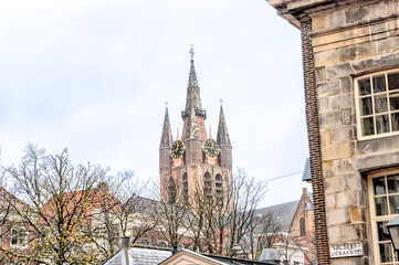 Fototapeta premium Delft, Netherlands - March 31, 2023: The iconic bell tower of the Old Church of Delft in the Netherlands 