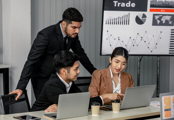 Financial advisors collaborate to assess a company's financial performance using data from its operational activities. Team members work together in a discussions meeting to develop a business plan.