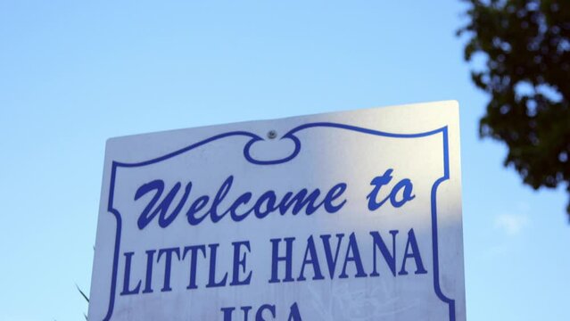 Tilt-Down Shot Of Welcome Sign With Design Against Clear Blue Sky - Miami, Florida