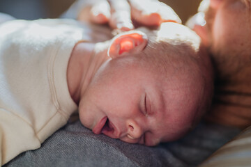 Close-up of father cudddling his little son.