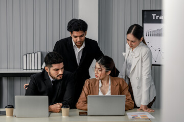 Financial advisors collaborate to assess a company's financial performance using data from its...