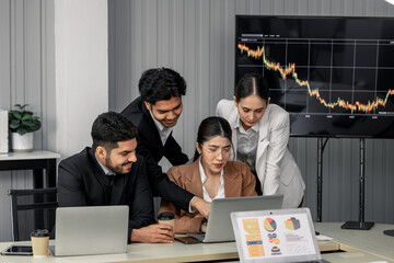 Financial advisors collaborate to assess a company's financial performance using data from its...