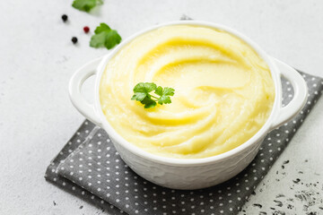 Fluffy mashed potatoes in a bowl. Top view, copy space, flat lay.