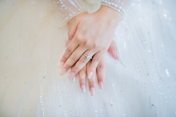 close up wedding ring in finger hand muslim bride in white dress catch the wedding ring.concept for...