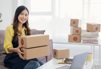 Small Entrepreneurs Start A Home Business By Arranging Goods With Brown Parcel Boxes, Small Home Business Startup Ideas..
