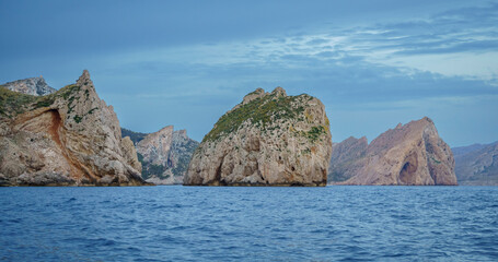 Es Colomer islet and Cala Boquer in the background, Tramuntana coast, Pollensa, Majorca, Balearic Islands, Spain