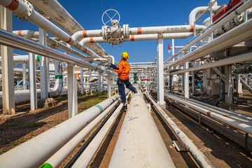 Naklejka premium Male worker inspection at valve of visual check record pipeline oil and gas